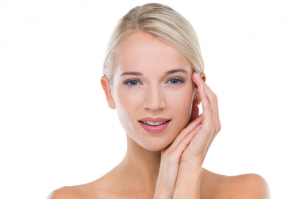 Blonde lady caressing hands on face after a thread lift in Manchester.
